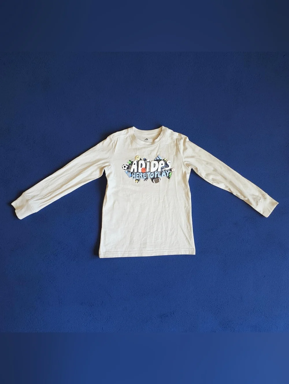 Adidas Cream Long Sleeve Tee with Playful Sports Graphic